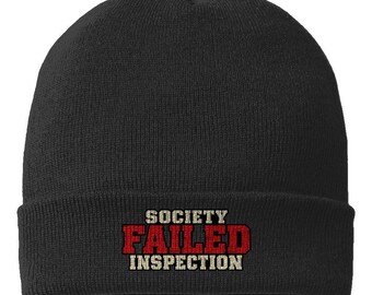 Black Society Failed Inspection cuffed beanie with its centered red and cream embroidery visible