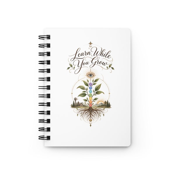 White Learn While You Grow spiral journal with the complete botanical cover design visible